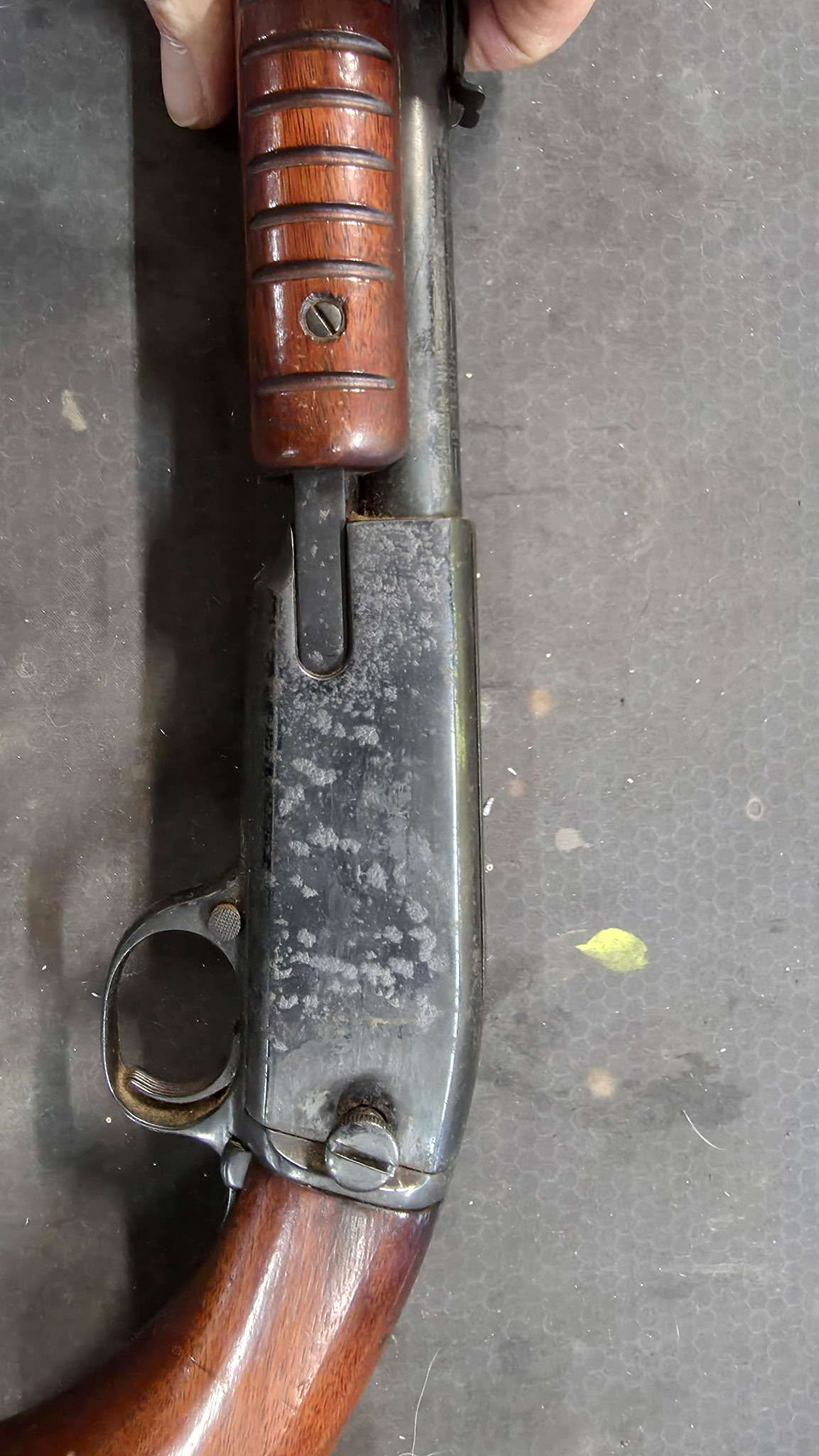 Vintage pump rifle before restoration — worn, rusted bluing